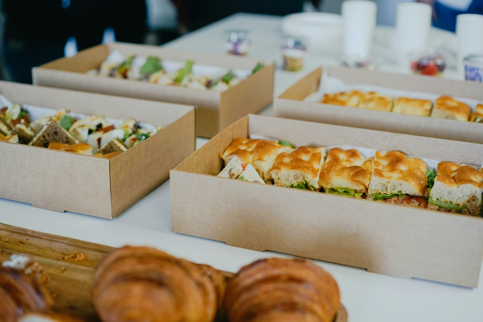 Catering boxes of sandwiches on a meeting table